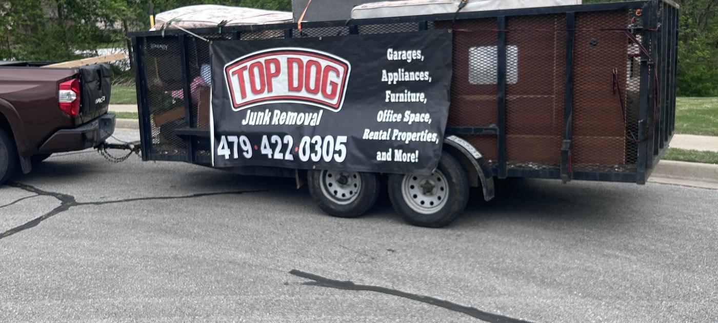Top Dog Junk Removal trailer on a job